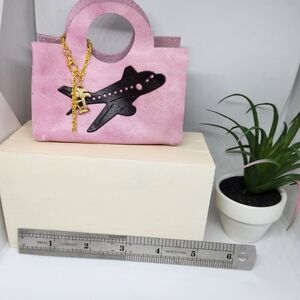 Pink Handbag with Airplane Design